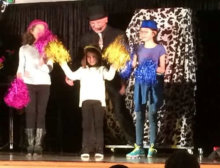Our 3 cheer leaders on stage helping with a fun magic routine... 